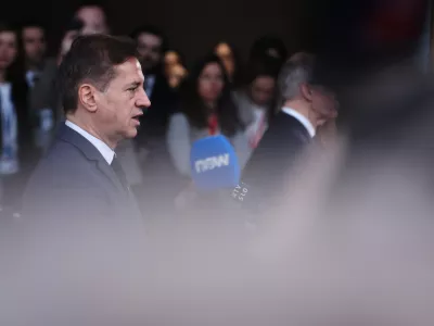 Slovenia's Prime Minister Robert Golob speaks with the media as he arrives for the EU summit at the European Council building in Brussels, Thursday, March 19, 2026. (AP Photo/Omar Havana)