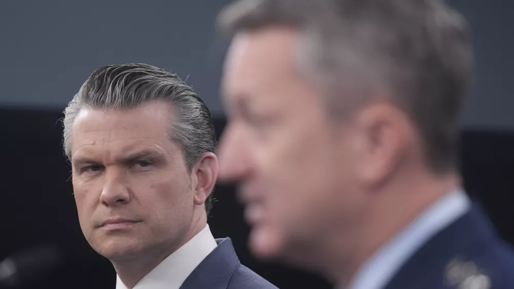 Defense Secretary Pete Hegseth and Chairman of the Joint Chiefs of Staff Gen. Dan Caine speak to members of the media during a press briefing at the Pentagon in Washington, Thursday, March 19, 2026. (AP Photo/Manuel Balce Ceneta)