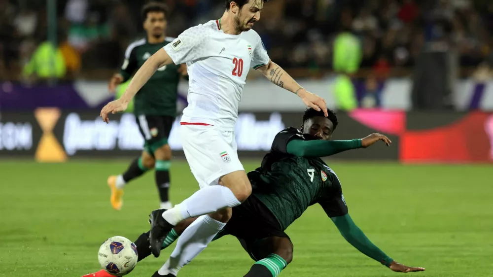 FILE PHOTO: Soccer Football - World Cup - AFC Qualifiers - Third Round - Group A - Iran v United Arab Emirates - Azadi Sports Complex, Tehran, Iran - March 20, 2025 Iran's Sardar Azmoun in action with United Arab Emirates' Kouame Kouadio Majid Asgaripour/WANA (West Asia News Agency) via REUTERS  ATTENTION EDITORS - THIS IMAGE HAS BEEN SUPPLIED BY A THIRD PARTY./File Photo