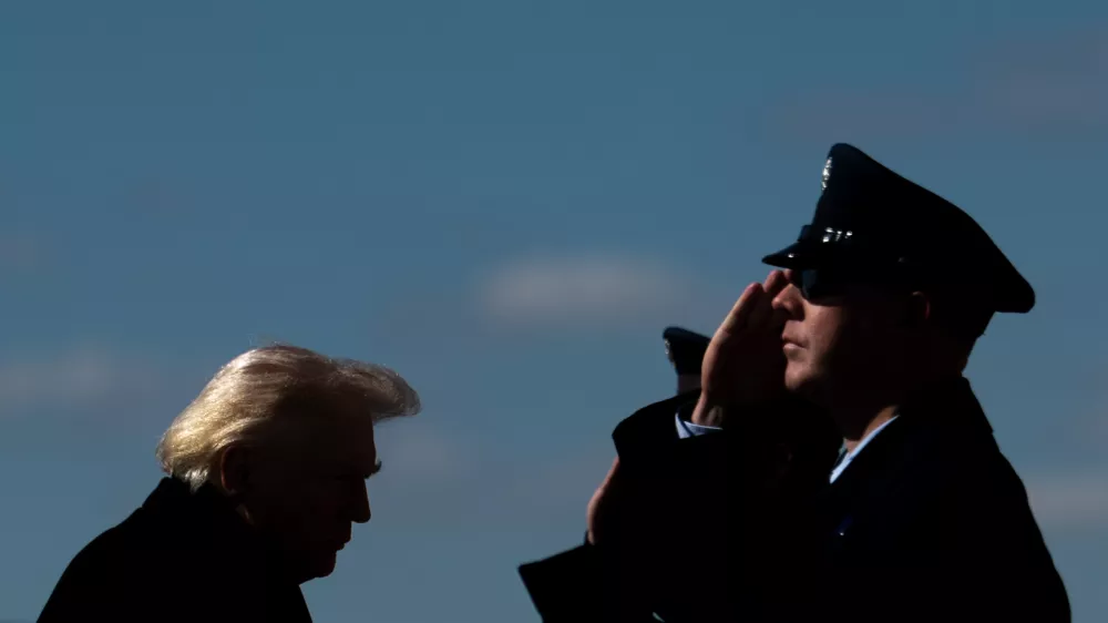 President Donald Trump walks to board Air Force One at Dover Air Force Base, Del., Wednesday, March 18, 2026, after attending the casualty return for the six crew members of an Air Force refueling aircraft who died when their plane crashed in western Iraq while supporting operations against Iran. (AP Photo/Julia Demaree Nikhinson)