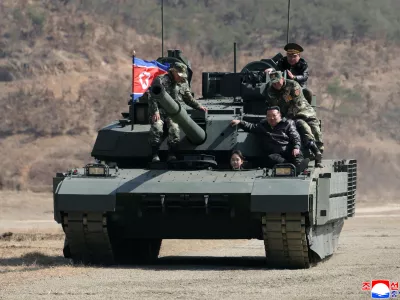 This photo provided by the North Korean government shows its leader Kim Jong Un, front right, his daughter, reportedly named Kim Ju Ae, and other soldiers on a tank at a military training base in North Korea, Thursday, March 19, 2026. Independent journalists were not given access to cover the event depicted in this image distributed by the North Korean government. The content of this image is as provided and cannot be independently verified. Korean language watermark on image as provided by source reads: "KCNA" which is the abbreviation for Korean Central News Agency. (Korean Central News Agency/Korea News Service via AP)