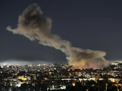 File - Smoke rises from Israeli airstrikes that struck a building housing Al-Manar channel studios in Dahiyeh, a southern suburb of Beirut, Lebanon, early on Tuesday, March 3, 2026. (AP Photo/Bilal Hussein, File)