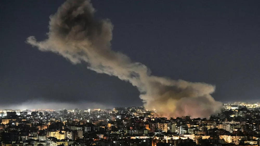 File - Smoke rises from Israeli airstrikes that struck a building housing Al-Manar channel studios in Dahiyeh, a southern suburb of Beirut, Lebanon, early on Tuesday, March 3, 2026. (AP Photo/Bilal Hussein, File)