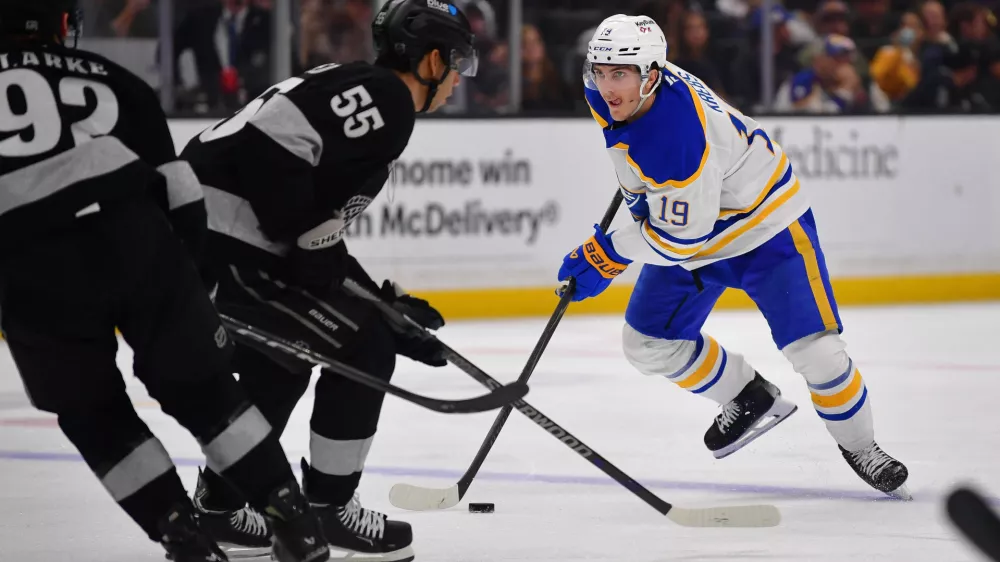 Mar 21, 2026; Los Angeles, California, USA; Buffalo Sabres center Peyton Krebs (19) moves the puck against the Los Angeles Kings during the third period at Crypto.com Arena. Mandatory Credit: Gary A. Vasquez-Imagn Images