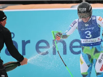 Slovenia's Ilka Stuhec celebrates her retirement at the finish area of an alpine ski, women's super-G race, at the Lillehammer World Cup Finals, in Kvitfjell, Norway, Sunday, March 22, 2026. (AP Photo/Marco Trovati)