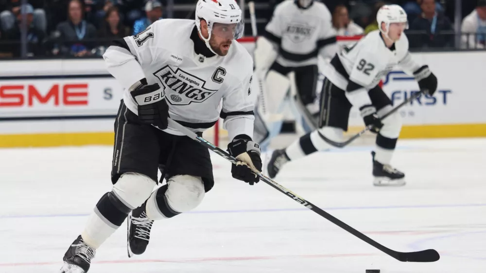 Mar 22, 2026; Salt Lake City, Utah, USA; Los Angeles Kings center Anze Kopitar (11) skates with the puck against Utah Mammoth during the second period at Delta Center. Mandatory Credit: Rob Gray-Imagn Images