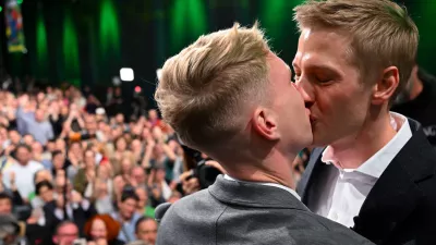 Dominik Krause, right, top candidate of the Green party, and his friend Sebastian Müller, on stage at the Green Party election party after the run-off election for the office of Lord Mayor in the Bavarian capital of Munich, Germany, Sunday, March 22, 2026. (Sven Hoppe/dpa via AP)
