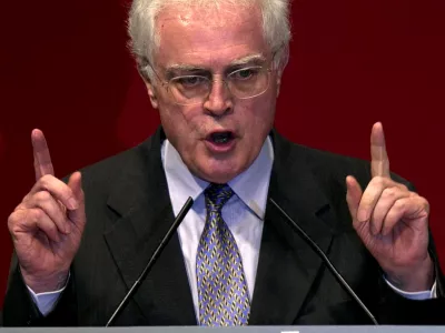FILE PHOTO: French Prime Minister Lionel Jospin gestures as he delivers a speech during a meeting of the Socialist party to promote the September 24th referendum, in France, September 19, 2000. REUTERS/Xavier Lhospice/File Photo