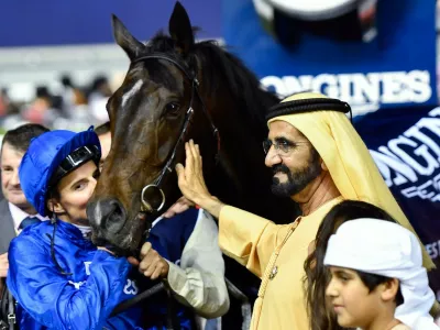 UAE Prime Minister and Ruler of Dubai Sheikh Mohammed bin Rashid al-Maktoum (C-R) celebrates with Jockey William Buick (C-L) and horse Jach Hobbs (C) after they won the Longines Dubai Sheema Classic at the Dubai World Cup in the Meydan Racecourse on March 25, 2017 in Dubai.,Image: 326506736, License: Rights-managed, Restrictions:, Model Release: no