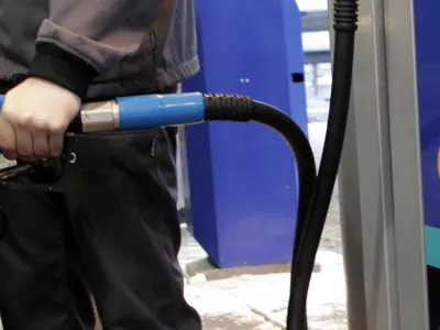 A man refuels his car with the ethanol fuel E85 at a Statoil fuel station in Stockholm, Sweden, Feb. 7, 2006. The E85 driven cars have become popular in the Swedish capital Stockholm after the introduction of congestion charges. An E85 car can run both on the ethanol fuel E85 and on regular gas. About one-quarter of the energy consumed in Sweden in 2003 came from renewable sources _ more than four times as much as the European Union average of 6 percent, according to EU statistics. (AP Photo/Maja Suslin Scanpix) ** SWEDEN OUT **