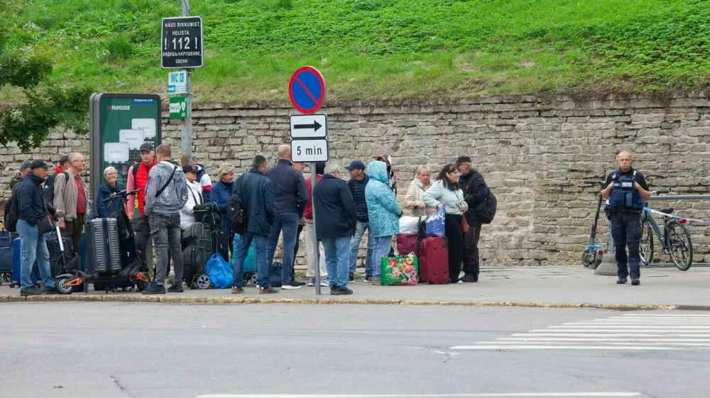 Narva, Estonia, 31 August 2025: On a Sunday afternoon in Peetri Square people queue at the pedestrian-only border point to cross from Estonia into Russia, and others travel in the opposite direction. Although the Estonian government advises against travel to Russia, many people in this 95% Russian-speaking enclave have connections over the border. Strict customs searches operate, often leading to long queues. No gold jewellery or European currencies can be taken into Russia, although American dollars and British pounds can be. Russians are not allowed to enter Estonia except to visit immediate family.,Image: 1033025490, License: Rights-managed, Restrictions: Usage restrictions: Advertising and promotion,Commercial electronic,Consumer goods,Direct mail and brochures,Indoor display,Internal business usage,Personal use, Model Release: no
