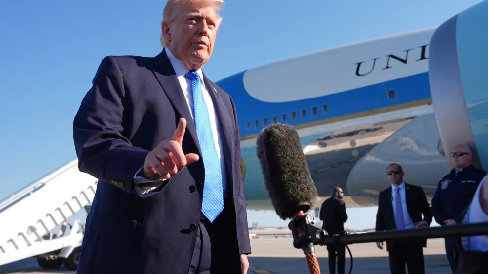 President Donald Trump speaks with the media before boarding Air Force One, Monday, March 23, 2026, at Palm Beach International Airport in West Palm Beach, Fla. (AP Photo/Mark Schiefelbein)