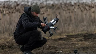 Yuriy, a service member of an air defence unit of the 420th Khort Separate Unmanned Systems Battalion prepares a P1-Sun FPV interceptor drone for a launch during his combat shift, amid Russia's attack on Ukraine, in Kharkiv region, Ukraine March 18, 2026. REUTERS/Valentyn Ogirenko
