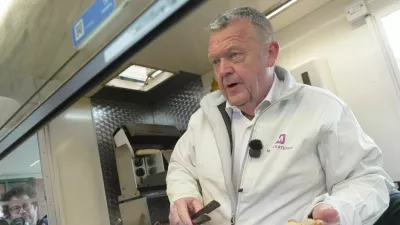 Denmark's Foreign Minister and head of the Moderates, Lars Lokke Rasmussen, holds a hot dog during a campaign event ahead of parliamentary elections in Copenhagen, Denmark, March 23, 2026. REUTERS/Leonhard Foeger