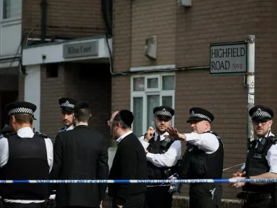 Police work near the scene, after four ambulances belonging to Hatzola, a Jewish community organisation, were set on fire in an incident that the police say is being treated as an antisemitic hate crime, in northwest London, Britain, March 23, 2026. REUTERS/Isabel Infantes