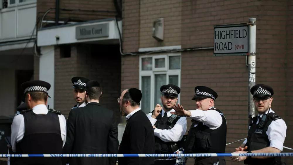 Police work near the scene, after four ambulances belonging to Hatzola, a Jewish community organisation, were set on fire in an incident that the police say is being treated as an antisemitic hate crime, in northwest London, Britain, March 23, 2026. REUTERS/Isabel Infantes