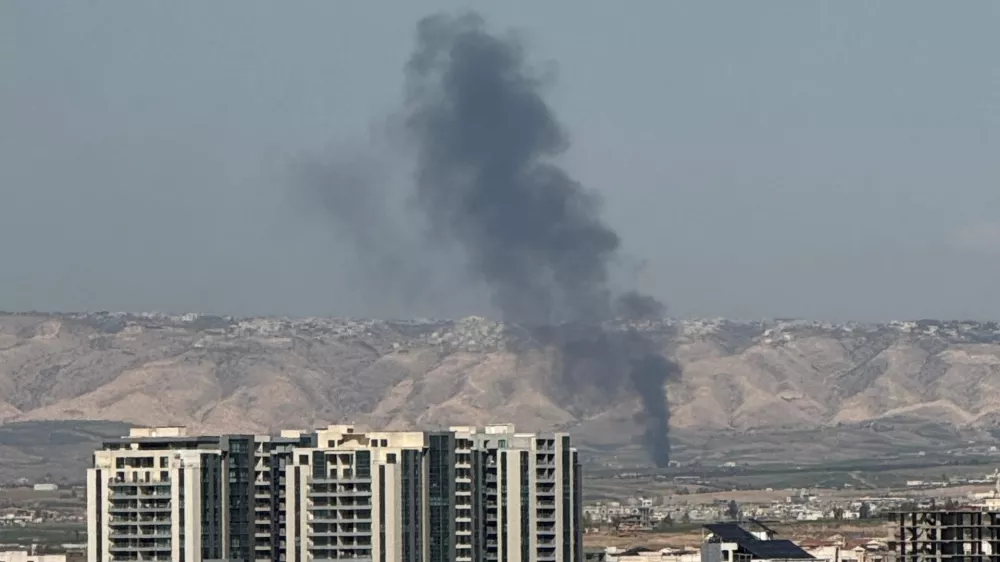 Smoke rises from the site of a drone crash on the outskirts of Erbil, Iraq, March 12, 2026. Picture taken on a mobile phone. REUTERS/Khalid Al-Mousily
