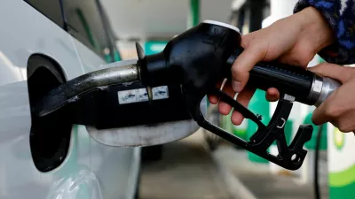 FILE PHOTO: A driver refuelling a car at a petrol station in Vienna, Austria, March 18, 2022. REUTERS/Leonhard Foeger/File Photo