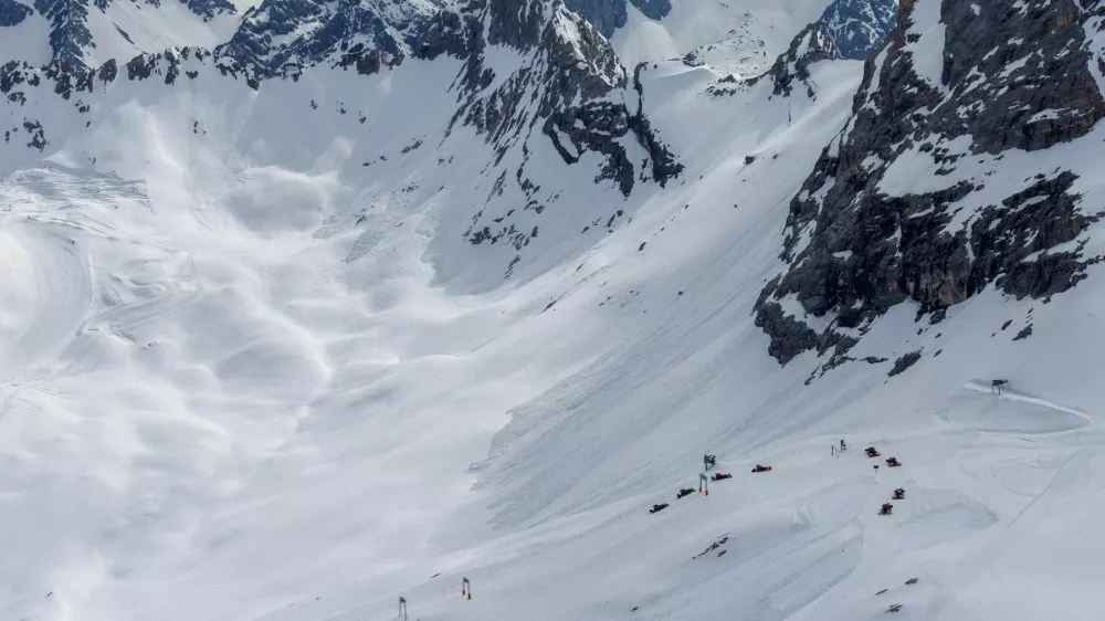 A beautiful view from the Zugspitze summit on the Alps on at spring. Bavarian Alps, Germany. Zugspitze Ski Resort. Spring in the Bavarian Alps.,Image: 993059564, License: Royalty-free, Restrictions:, Model Release: yes