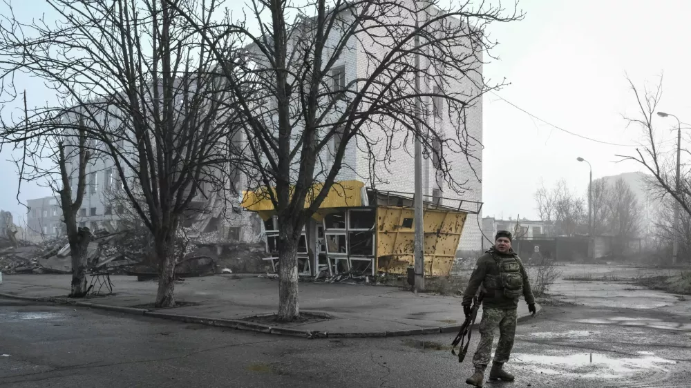 A Ukrainian service member walks on a street, amid Russia's attack on Ukraine, in the frontline town Orikhiv in Zaporizhzhia region, Ukraine March 26, 2026. REUTERS/Stringer