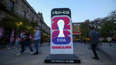 People walk past a countdown clock for the FIFA World Cup 2026 as the city prepares for the tournament, jointly hosted by the United States, Canada and Mexico, in Guadalajara, Mexico, March 24, 2026. REUTERS/Eloisa Sanchez