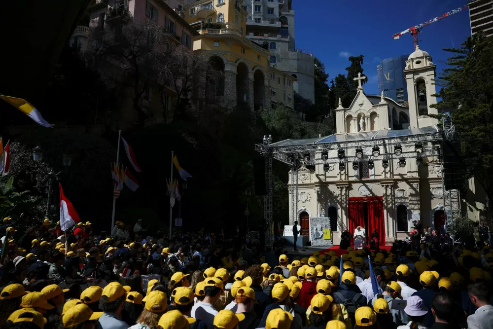 Pope Leo XIV attends a meeting with young people and catechumens outside the Church of Saint Devota, as part of a one-day trip in Monaco, March 28, 2026. REUTERS/Guglielmo Mangiapane