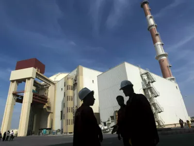 Iranian workers stand in front of the Bushehr nuclear power plant, about 1,200 km (746 miles) south of Tehran in this October 26, 2010 file photo. Iran and six major world powers have reached a nuclear deal after more than a decade of on-off negotiation, granting Tehran sanctions relief in exchange for curbs on its nuclear program, Iranian diplomats said on Tuesday. REUTERS/Mehr News Agency/Majid Asgaripour/FilesFROM THE FILES PACKAGE - IRAN DEAL - SEARCH "IRAN FILES" TO FIND ALL 27 IMAGES
