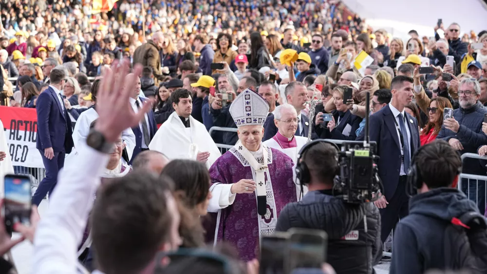 Pope Leo XIV leaves at the end of a mass at Stade Louis II in Fontvieille, Monaco, Saturday, March 28, 2026. (AP Photo/Laurent Cipriani)