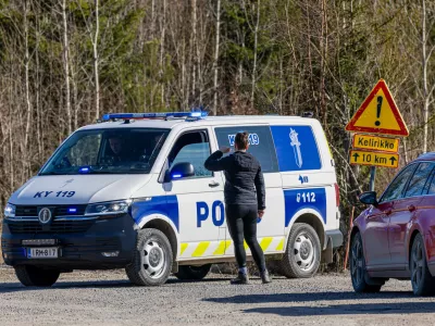 A Police car blocks the Savistontie road after two unidentified drones entered and landed in Finnish territory, in Kouvola, Finland, Sunday, March 29, 2026 (Sasu J&auml;rnstedt/Lehtikuva via AP)