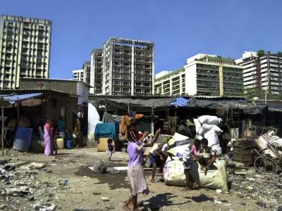 Children play in a slum in Bombay, India, Wednesday, Feb. 2, 2005. 80,000 shanties have been demolished since Dec. 7 across India's financial capital, part of an ambitious 370 billion rupee (US.2 billion; euro6.3 billion) urban renewal plan for broader roads, new rail lines and bigger bridges. Officials say the shanties blocked the new projects, but activists say some 350,000 slum dwellers are now homeless. 54 percent of Bombay's estimated 15 million people live in slums along railway tracks, on sidewalks, in parks or encroachments on government land. (AP Photo/Rajesh Nirgude)