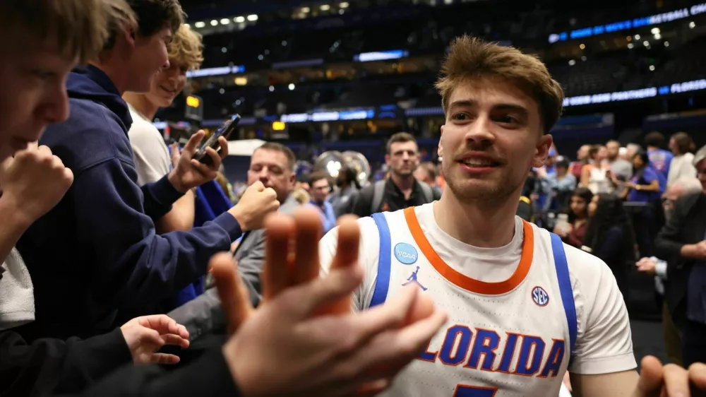 Florida guard Urban Klavzar (7) greets fans after Florida?s 114-55 win over Prairie View A&M of the NCAA March Madness opening round at Benchmark international Arena in Tampa, FL on Friday, March 20, 2026. [Alan Youngblood/Gainesville Sun]