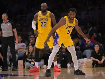 Mar 30, 2026; Los Angeles, California, USA; Los Angeles Lakers guard Bronny James (9) and forward LeBron James (23) defend on the court in the second half against the Washington Wizards at Crypto.com Arena. Mandatory Credit: Jayne Kamin-Oncea-Imagn Images