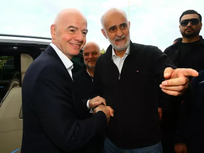 Soccer Football - International Friendly - Costa Rica v Iran - Antalya Stadium, Antalya, Turkey - March 31, 2026 First vice president of the Islamic Republic of Iran Football Federation Mehdi Mohammad Nabi shakes hands with FIFA president Gianni Infantino before the match REUTERS/Kaan Soyturk