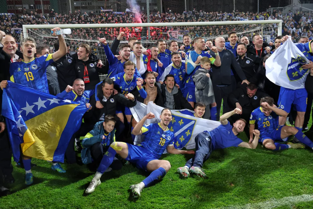Bosnia players celebrate after winning a penalty shootout at the end of the World Cup qualifying playoff final soccer match between Bosnia and Italy in Zenica, Bosnia, Tuesday, March 31, 2026. (AP Photo/Armin Durgut)