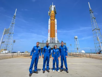 This photo provided by NASA shows NASA astronauts Reid Wiseman, Artemis II commander, from left, Victor Glover, Artemis II pilot, Christina Koch, Artemis II mission specialist, and CSA (Canadian Space Agency) astronaut Jeremy Hansen, Artemis II mission specialist, right, in a group photograph as they visit NASA's Artemis II SLS (Space Launch System) rocket and Orion spacecraft, Monday, March 30, 2026, at Launch Complex 39B of NASA's Kennedy Space Center, in Cape Canaveral, Fla. (Bill Ingalls/NASA via AP)