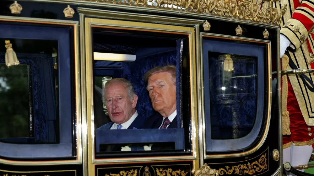 FILE PHOTO: Britain's King Charles and U.S. President Donald Trump sit in a carriage during a procession through Windsor Castle, in Windsor, Britain, September 17, 2025. REUTERS/Toby Melville/Pool   TPX IMAGES OF THE DAY/File Photo