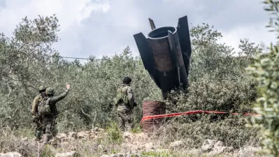 Soldiers seen inspecting a missile fragment. A huge fragment of the Iranian ballistic missile landed in the rural area, central Israel, with out causing any damage.