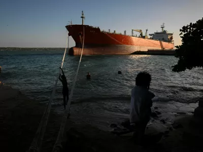 People spend time near the Cuban-flagged tanker Alicia moored at the Matanzas terminal as Cuba awaits the arrival of the Russian-flagged tanker Anatoly Kolodkin with oil, amid a months-long energy crisis since President Donald Trump's administration cut off its fuel supply, in Matanzas, Cuba, March 30, 2026. REUTERS/Norlys Perez