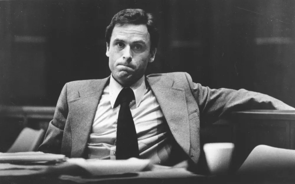 FILE - Accused murderer Ted Bundy attends the second day of jury selection in his murder trial, June 27, 1979, in Miami, Fla. (AP Photo,File)