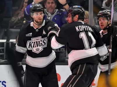 Los Angeles Kings right wing Adrian Kempe (9) is congratulated by Kings' center Anze Kopitar after scoring a goal during the second period of an NHL hockey game against the Nashville Predators, Thursday, April 2, 2026, in Los Angeles. (AP Photo/Jayne Kamin-Oncea)