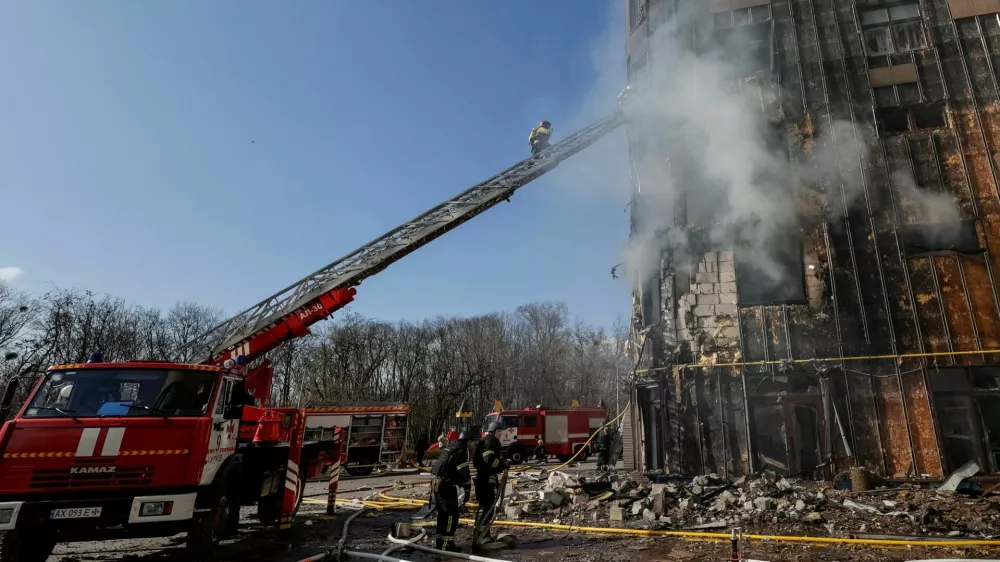 Firefighters work at the scene of an apartment building hit by a Russian drone strike, amid Russia's attack on Ukraine, in Kharkiv, Ukraine, April 2, 2026. REUTERS/Sofiia Gatilova