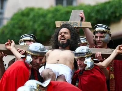 Members of the Italian community take part in a re-enactment of the crucifixion of Jesus Christ on Good Friday in Bensheim, southwest of Frankfurt, Germany, April 3, 2026. REUTERS/Kai Pfaffenbach