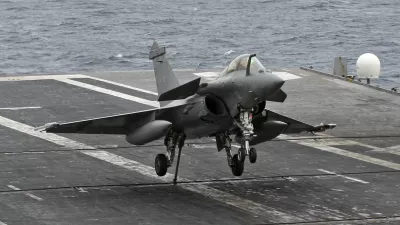 A Rafale fighter jet makes a cable arrest landing on the flight deck of French aircraft carrier "Charles De Gaulle" during sea trials in the Mediterranean sea in this November 26, 2009 file picture. France could start military operations against Libya in a matter of hours following the U.N. Security Council resolution authorising such action, government spokesman Francois Baroin said on March 18, 2011.  REUTERS/Jean-Paul Pelissier/Files (FRANCE - Tags: TRANSPORT MILITARY POLITICS)