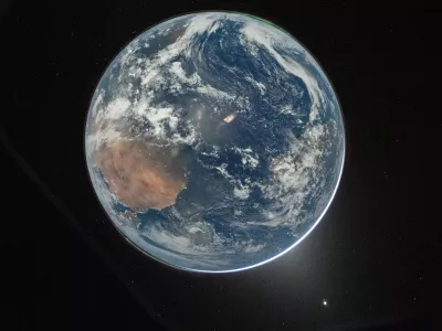 This image provided by NASA shows a view of Earth taken by NASA astronaut and Artemis II Commander Reid Wiseman from of the Orion spacecraft's window after completing the translunar injection burn on April 2, 2026. (NASA via AP)