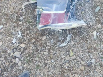 The Iranian state media said to show fragments of a downed U.S. jet in this picture said to be taken in central Iran and released on April 3, 2026. IRIB/Handout via REUTERS  THIS IMAGE HAS BEEN SUPPLIED BY A THIRD PARTY. IRAN OUT. NO COMMERCIAL OR EDITORIAL SALES IN IRAN. NO USE BBC PERSIAN. NO USE VOA PERSIAN. NO USE MANOTO. NO USE IRAN INTERNATIONAL. NO USE RADIO FARDA. REFILE - CORRECTING FROM "JETS" TO "JET" VERIFICATION: -Reuters was not able to confirm the location or date when the photos were taken. -The red stripe seen on the tail fin of the plane in the photos is consistent with the tail section of a F-15E Strike Eagle seen in file photos.