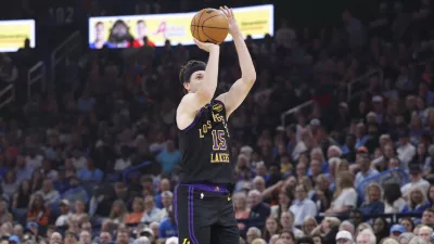 Apr 2, 2026; Oklahoma City, Oklahoma, USA; Los Angeles Lakers guard Austin Reaves (15) shoots a three point basket against the Oklahoma City Thunder during the first quarter at Paycom Center. Mandatory Credit: Alonzo Adams-Imagn Images