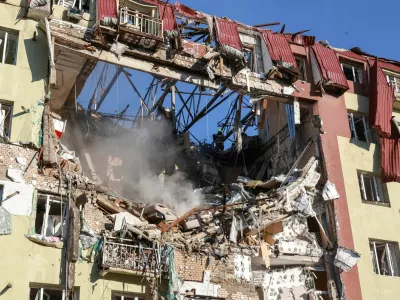 Rescuers work at the site of an apartment building hit by a Russian drone strike, amid Russia's attack on Ukraine, in Odesa, Ukraine, April 6, 2026. REUTERS/Nina Liashonok