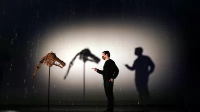 23 November 2021, United Kingdom, Edinburgh: A person views a whicker mask displayed at the exhibition Khvay Samnang: Calling for Rain. The exhibition by Cambodia-based artist Khvay Samnang also features two 11 metre long multicoloured curtains of rain. Photo: Andrew Milligan/PA Wire/dpa