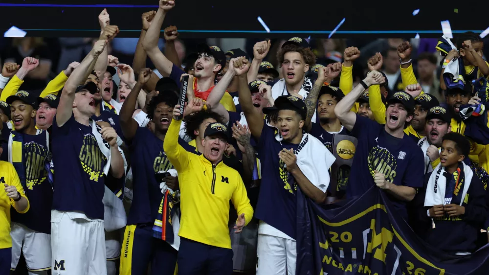 Apr 6, 2026; Indianapolis, IN, USA; Michigan Wolverines head coach Dusty May celebrates after defeating the UConn Huskies in the national championship of the Final Four of the men's 2026 NCAA Tournament at Lucas Oil Stadium. Mandatory Credit: Trevor Ruszkowski-Imagn Images