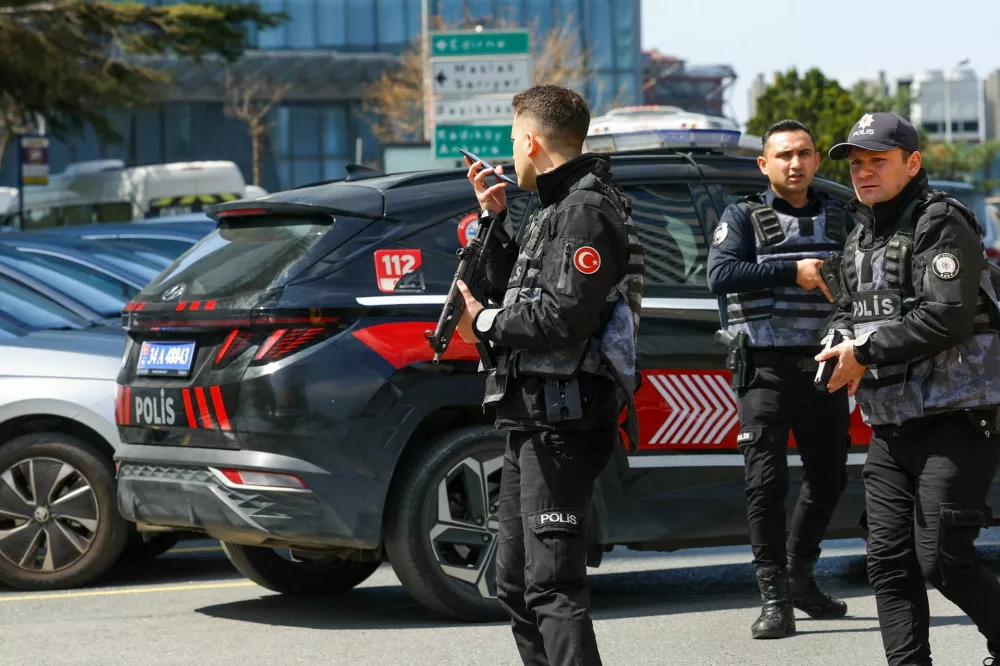Police work at the scene, after gunfire was heard near the building housing the Israeli consulate, according to a witness, in Istanbul, Turkey, April 7, 2026. REUTERS/Murad Sezer